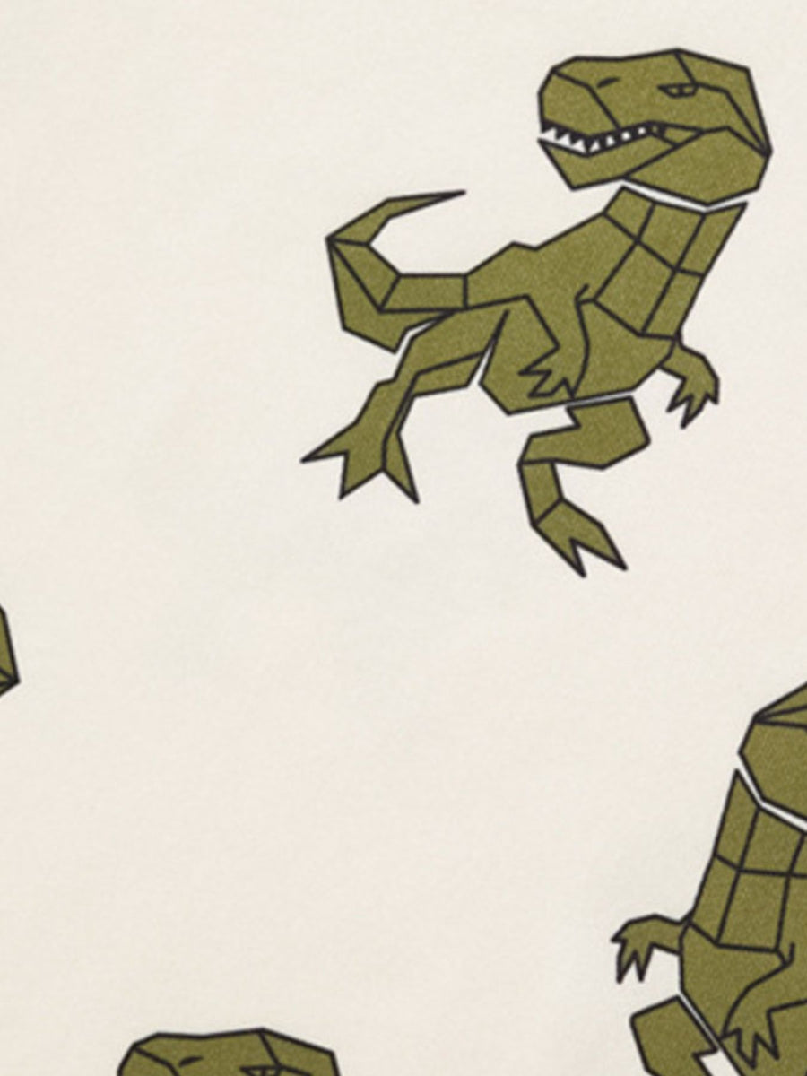 Toddler tee and shorts set with geometric dinosaur print in olive green on cream fabric.