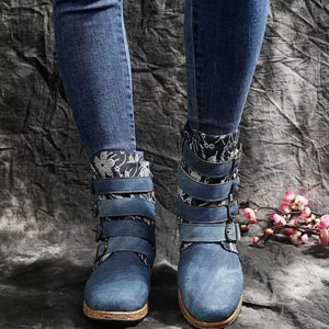 Blue suede ankle boots with floral cuff and decorative buckle straps