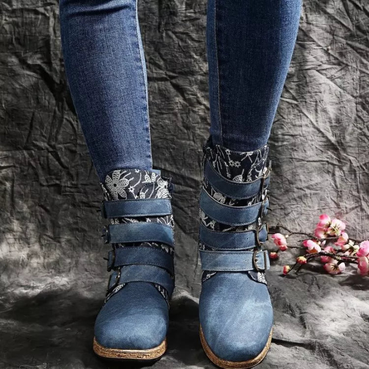 Blue suede ankle boots with floral cuff and decorative buckle straps