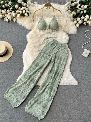 Green crochet halter bikini top with shell trim and matching wide-leg pants with diamond pattern.