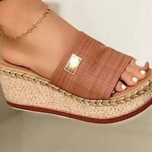 Caramel textured platform slides with metallic detail and espadrille sole.