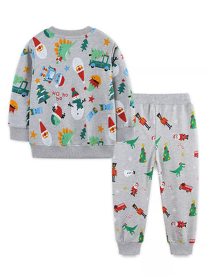 Children's gray cotton Christmas print pajama set with dinosaurs, Santas, snowmen, and nutcrackers.