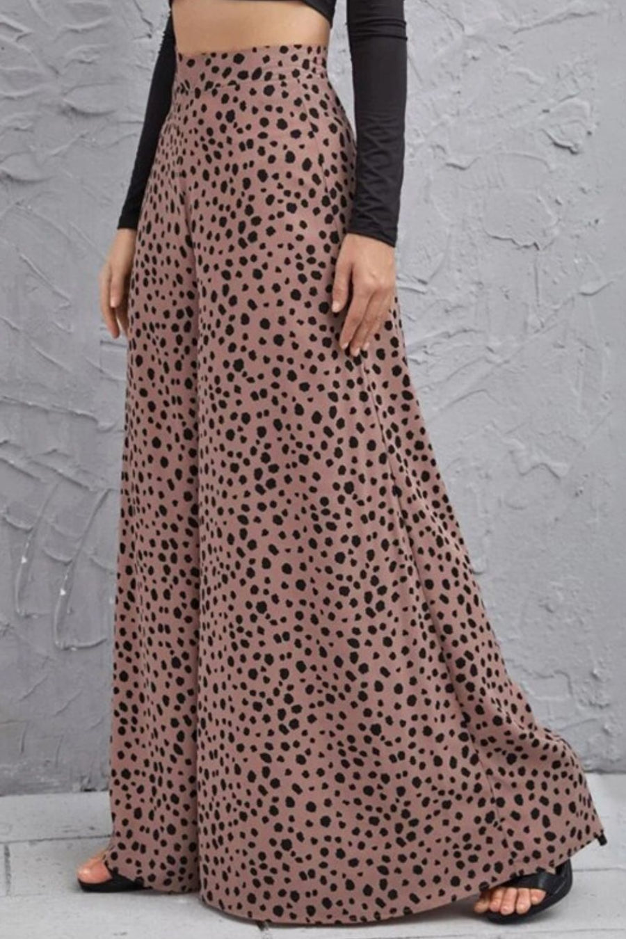 Spotted wide-leg palazzo trousers in dusty pink with a black animal print.