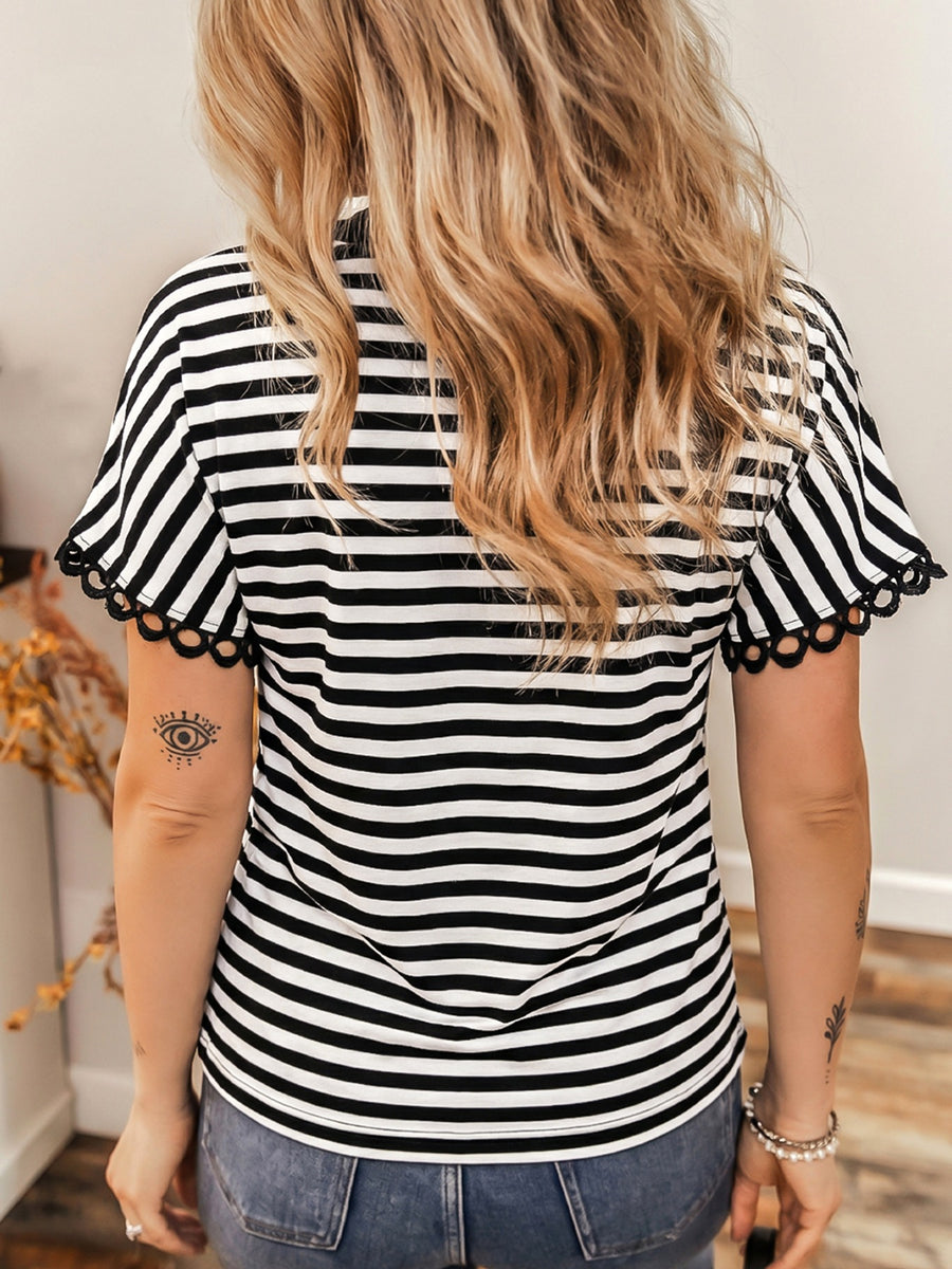 Black and white striped t-shirt with scalloped trim on short sleeves.