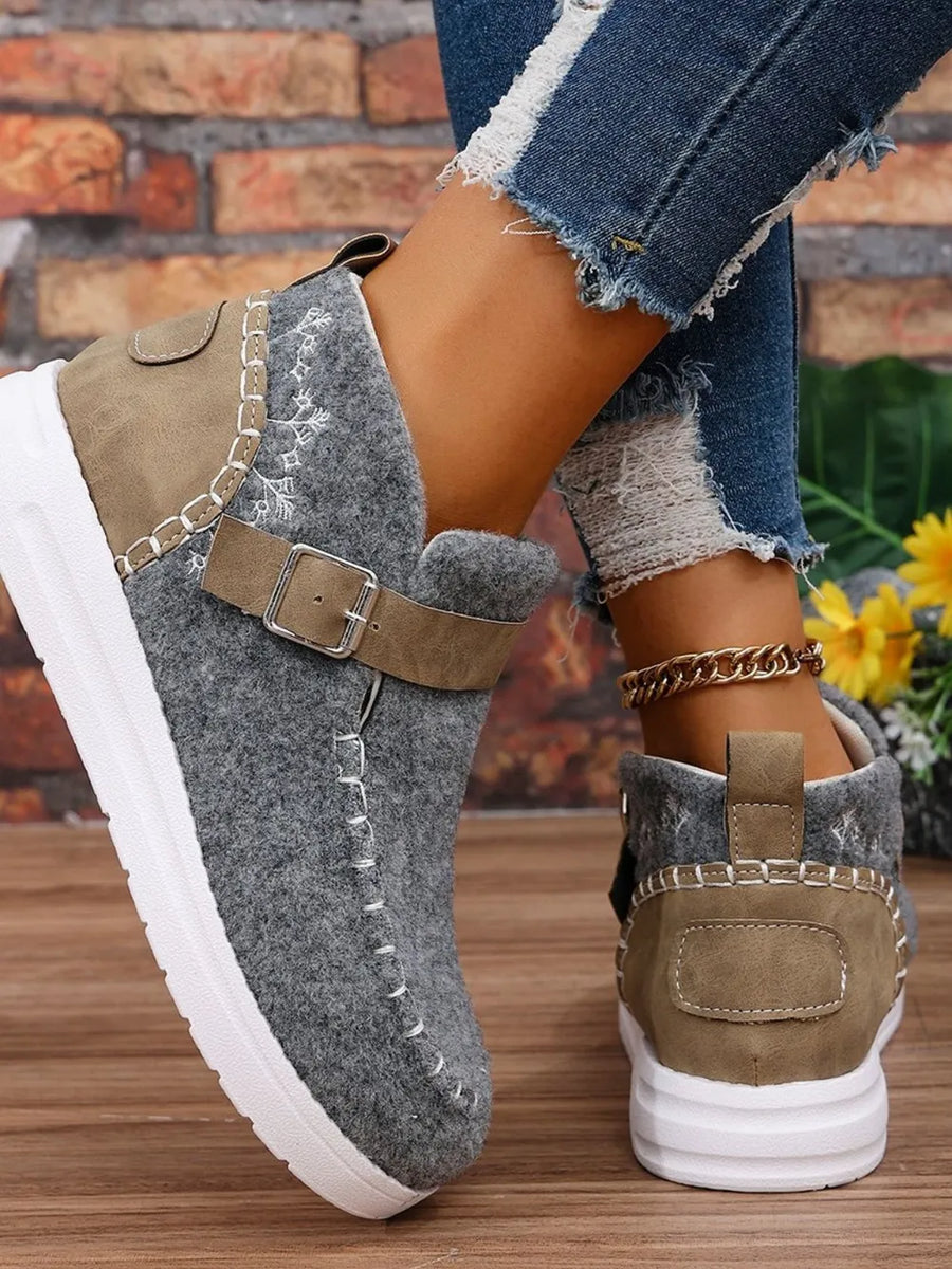 Gray textured stitch-detail buckle sneakers with brown accents and white soles.