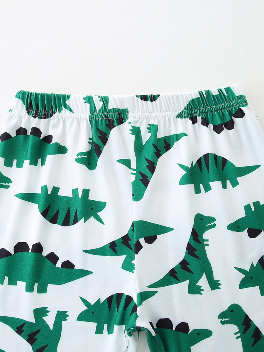 Baby shorts with white cotton blend and green dinosaur print