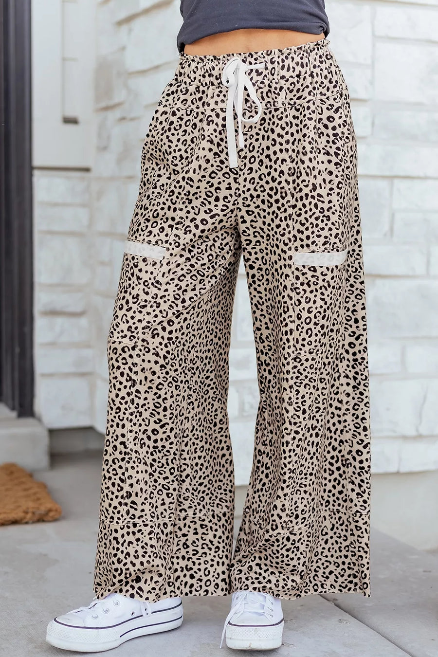 100% polyester Care instructions: Machine wash cold wide-leg pants in Leopard with flared silhouette