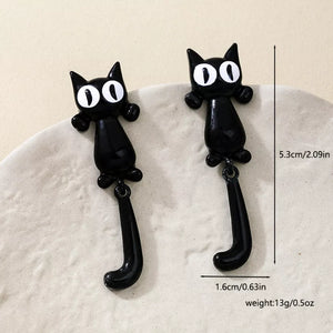 earrings in white with novelty and dangle