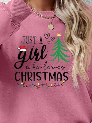 Blush Pink sweatshirt with "Just a girl who loves Christmas" graphic and string lights.