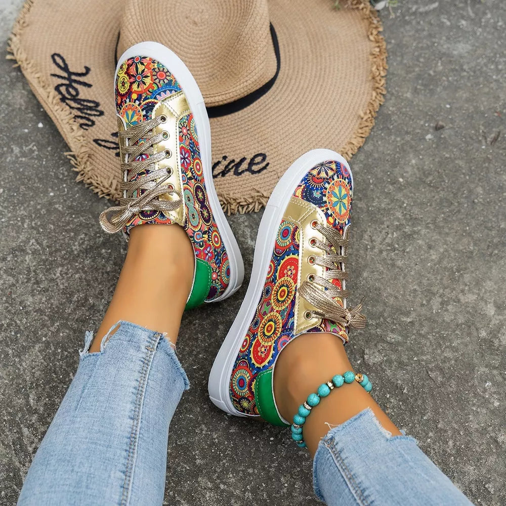 Mandala print round toe sneakers with gold accents and green heel detail.