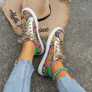 Mandala print round toe sneakers with gold accents and green heel detail.