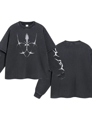 Black distressed graphic long sleeve tee with layered sleeves and abstract white print.