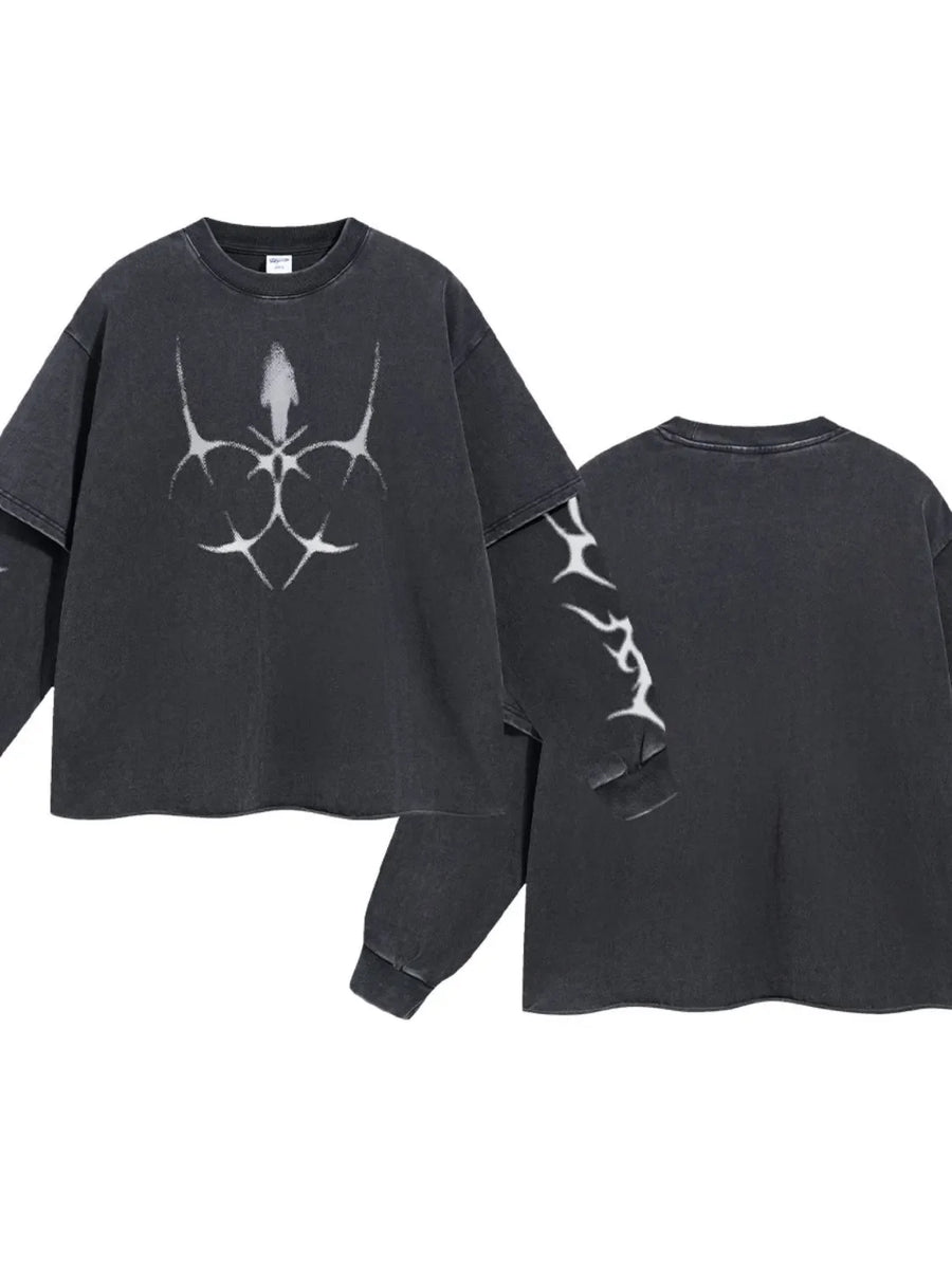 Black distressed graphic long sleeve tee with layered sleeves and abstract white print.