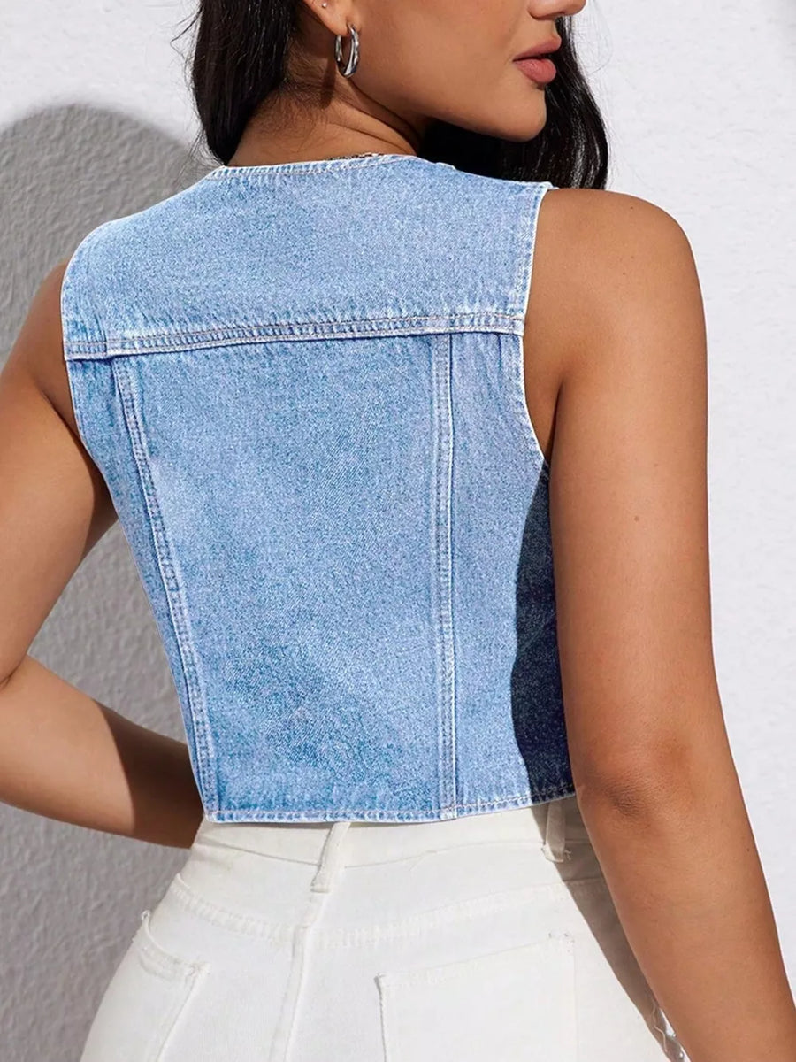Light wash denim cropped vest with drawstring detail and visible stitching.