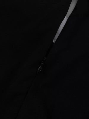 Black dress with a side zipper detail and a subtle sheen.