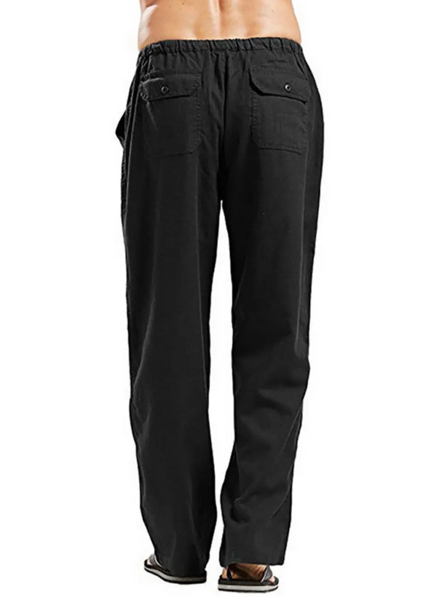 Black linen drawstring trousers with relaxed fit and two back pockets.