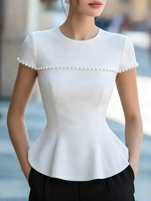White peplum t-shirt with pearl trim on neckline and sleeves