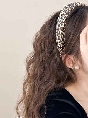 Leopard print padded headband in brown and tan, a comfortable hair accessory.