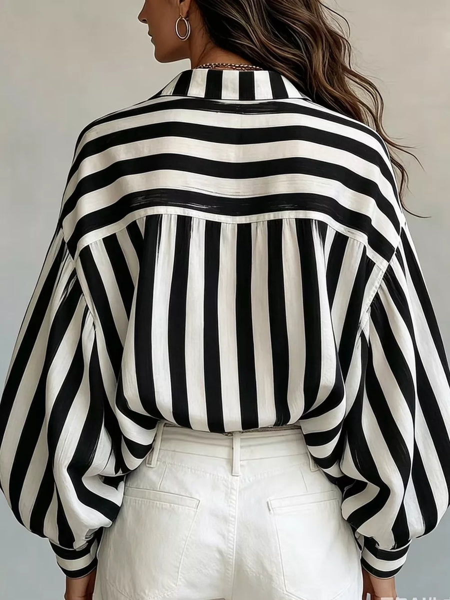 button-up shirt in Black with button cuffs and hip-length