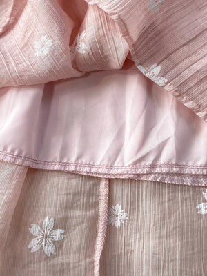 Dusty pink midi dress with white floral embroidery and puff sleeves detail