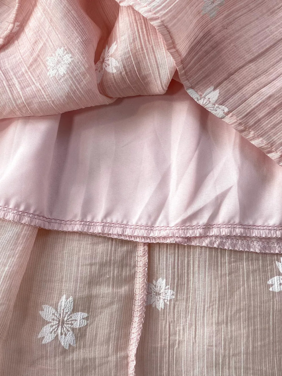 Dusty pink midi dress with white floral embroidery and puff sleeves detail