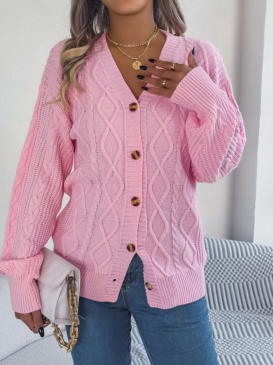 Pink cable knit balloon sleeve cardigan with button front and v-neck.