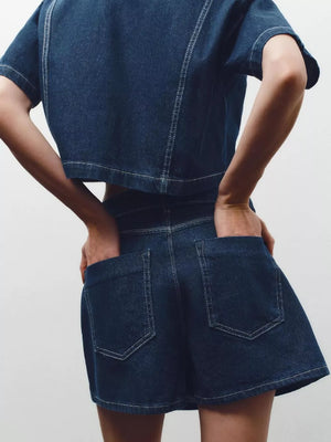 Dark blue cotton cropped top and skort set with contrast stitching.