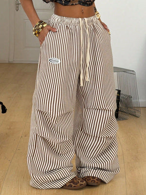 cargo pants in cream featuring pocketed and wide-leg fit