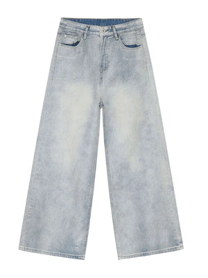 Faded denim palazzo jeans in light wash, featuring a relaxed, oversized fit and wide legs.