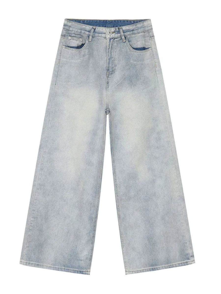 Faded denim palazzo jeans in light wash, featuring a relaxed, oversized fit and wide legs.