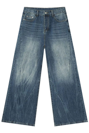 Oversized wash-effect palazzo jeans in medium blue denim with a wide leg and distressed details.