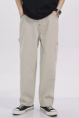 Relaxed fit beige cargo sweatpants with utility pockets and a casual style.