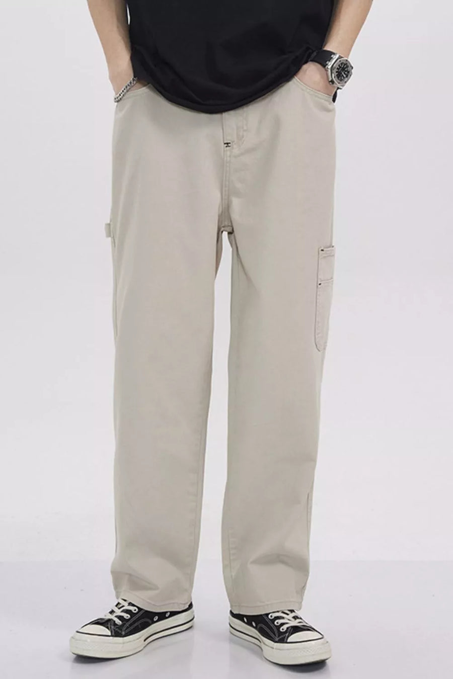 Relaxed fit beige cargo sweatpants with utility pockets and a casual style.