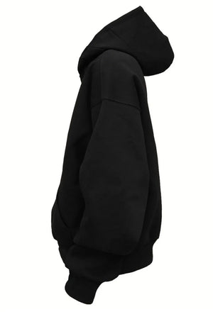 Black oversized slouch hoodie with kangaroo pocket and drawstring hood.