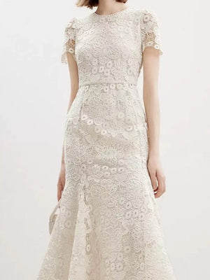 Cream floral lace mermaid gown with cap sleeves and a high neckline.