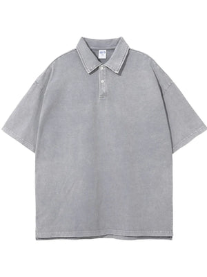 Oversized gray washed polo shirt with a relaxed fit and short sleeves.