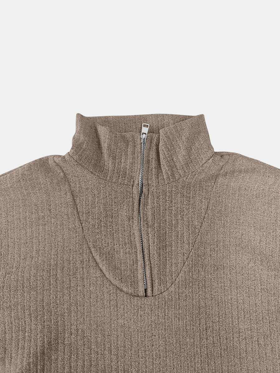 Ribbed knit quarter-zip pullover sweater in taupe with a mock neck and silver zipper detail.