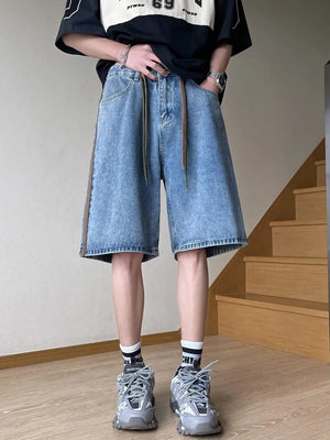Men's blue wide-leg denim shorts with drawstring and side stripe detail