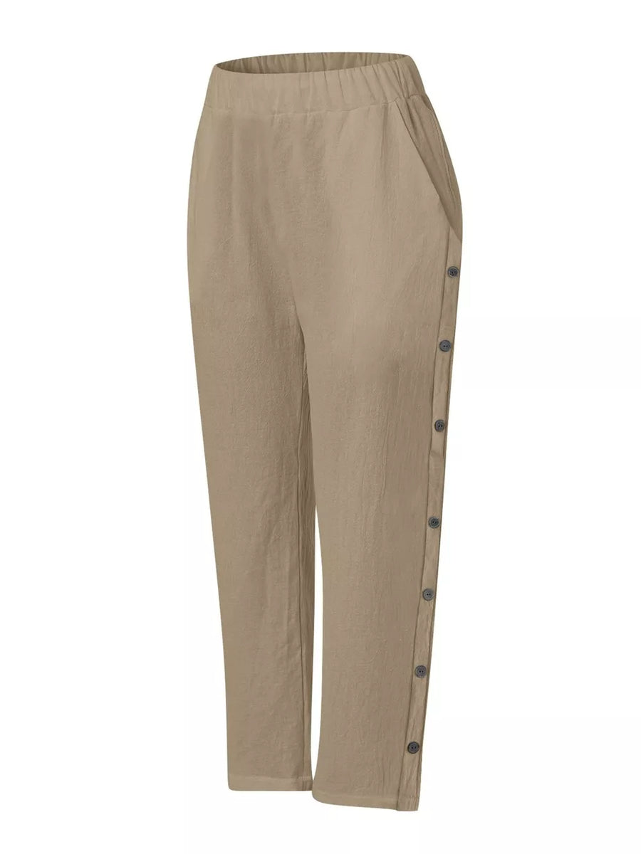 Khaki relaxed fit pants with decorative side buttons and elastic waist