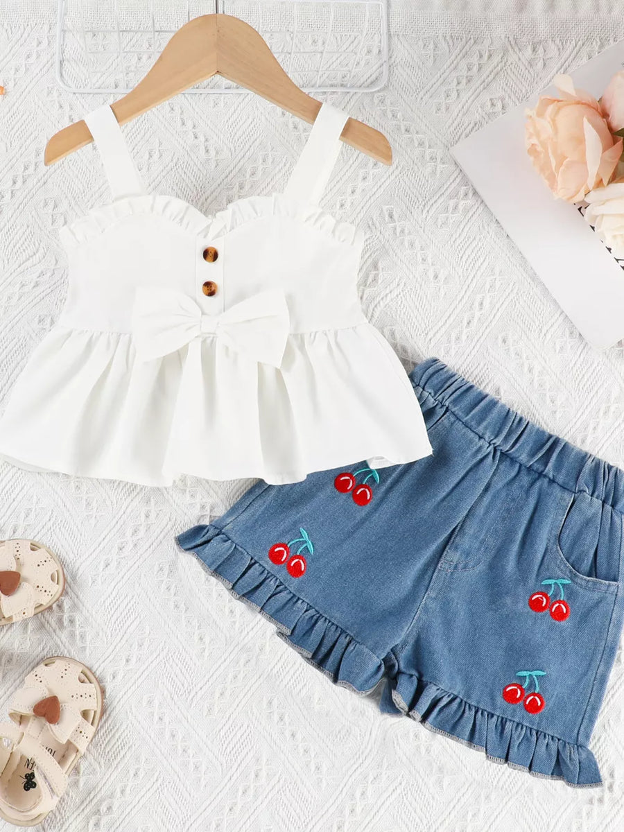 White ruffle-trim bow top with cherry embroidered denim shorts set