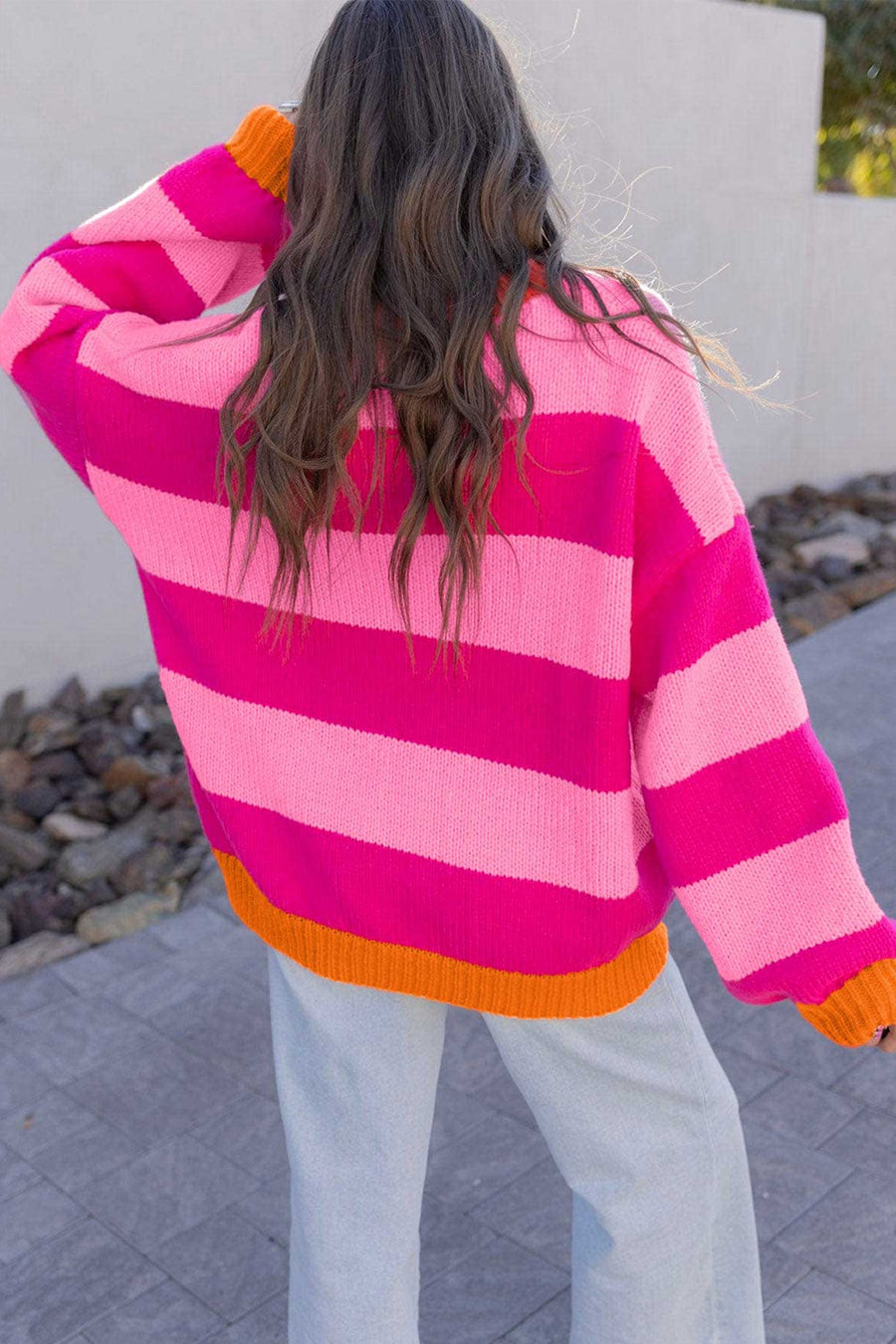 65% acrylic, 35% polyamide Care instructions: Machine wash cold pullover sweater in orange with relaxed silhouette