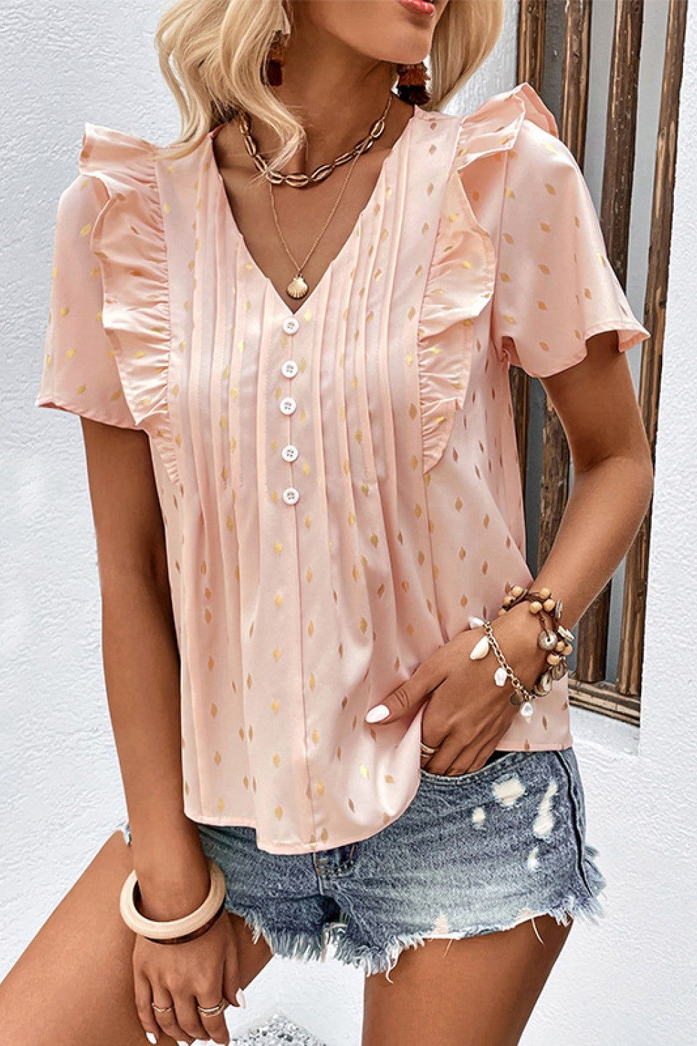 Watermelon pink dotted ruffle front button-down blouse with pintuck detail.