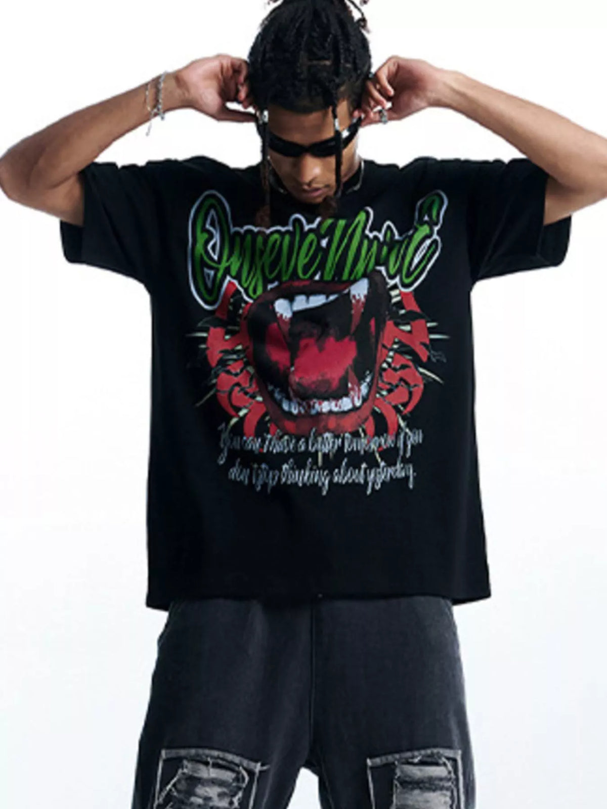 Black 100% cotton oversized t-shirt with bold graphic print of mouth and text.