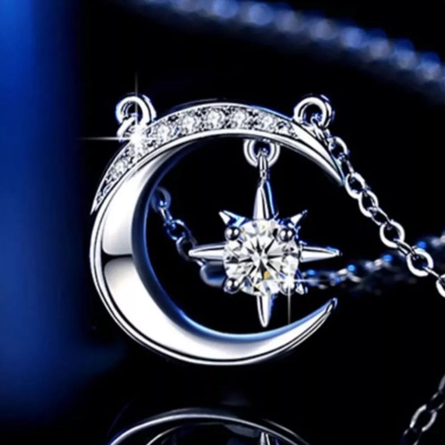 Celestial Moissanite Crescent Necklace with a diamond-accented moon and star charm.