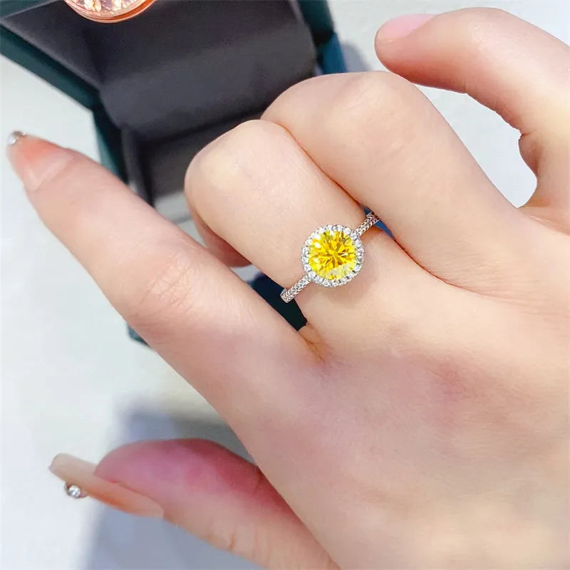 Halo-set canary diamond ring in silver with a halo of smaller diamonds.
