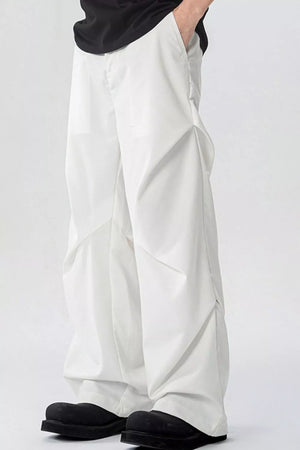 White men's wide-leg sweatpants with pockets and a relaxed fit.