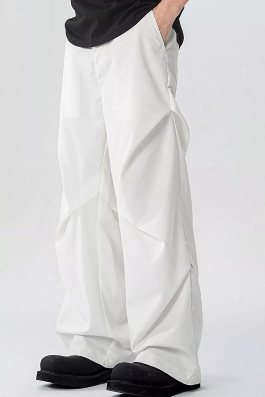 White men's wide-leg sweatpants with pockets and a relaxed fit.
