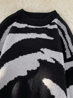 Black and white striped knit sweater with crew neck