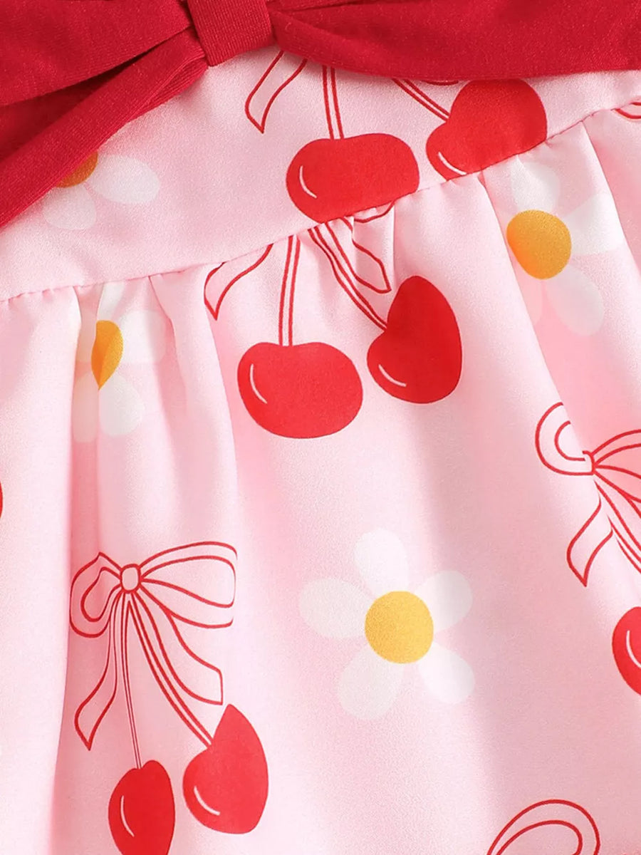 Pink baby dress with cherry and bow print, red bow detail