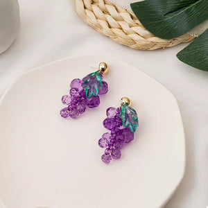 Grape-inspired beaded dangle earrings with purple acrylic beads and green leaves.